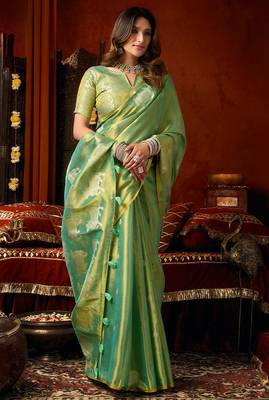 Sea green heavy tissue allover cow woven butta with tassels saree with blouse 3