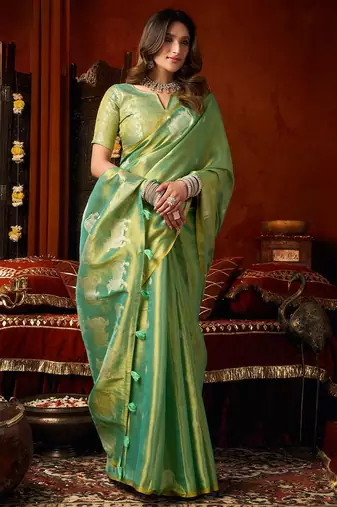Sea green heavy tissue allover cow woven butta with tassels saree with blouse