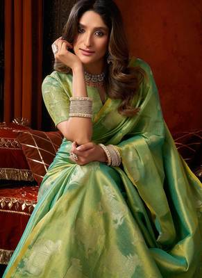 Sea green heavy tissue allover cow woven butta with tassels saree with blouse 5