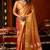 Orange heavy tissue allover cow woven butta with tassels saree with blouse