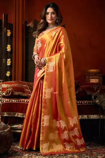 Orange heavy tissue allover cow woven butta with tassels saree with blouse