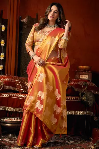 Orange heavy tissue allover cow woven butta with tassels saree with blouse