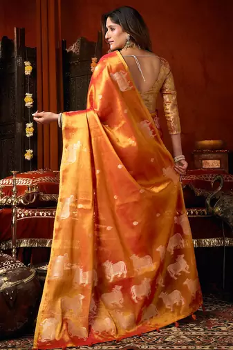 Orange heavy tissue allover cow woven butta with tassels saree with blouse