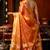 Orange heavy tissue allover cow woven butta with tassels saree with blouse