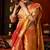 Orange heavy tissue allover cow woven butta with tassels saree with blouse