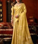 Yellow heavy tissue allover cow woven butta with tassels saree with blouse