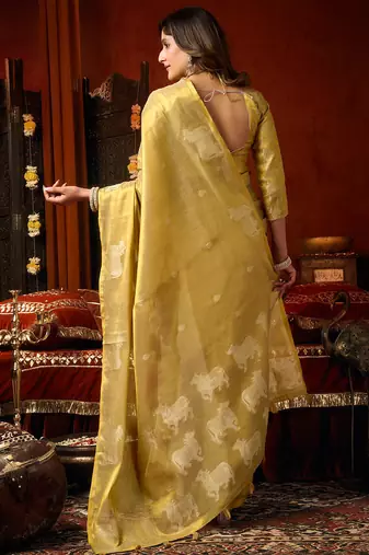 Yellow heavy tissue allover cow woven butta with tassels saree with blouse