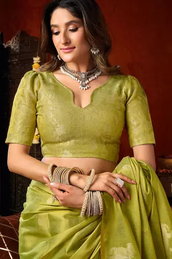 Parrot green heavy tissue allover cow woven butta with tassels saree with blouse