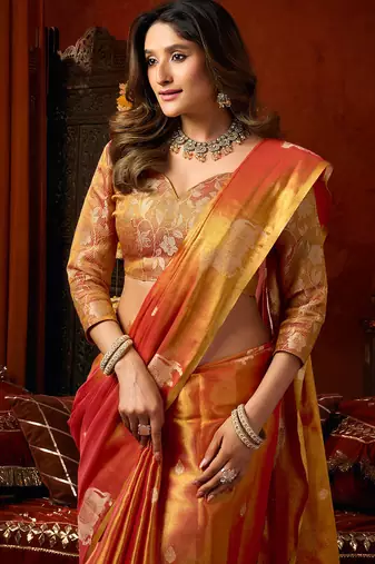 Orange heavy tissue allover cow woven butta with tassels saree with blouse