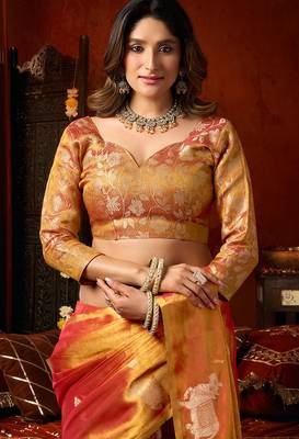 Orange heavy tissue allover cow woven butta with tassels saree with blouse 7