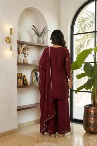 Red embroidered readymade suit