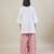 Stark white cotton kurta set with pink dupatta