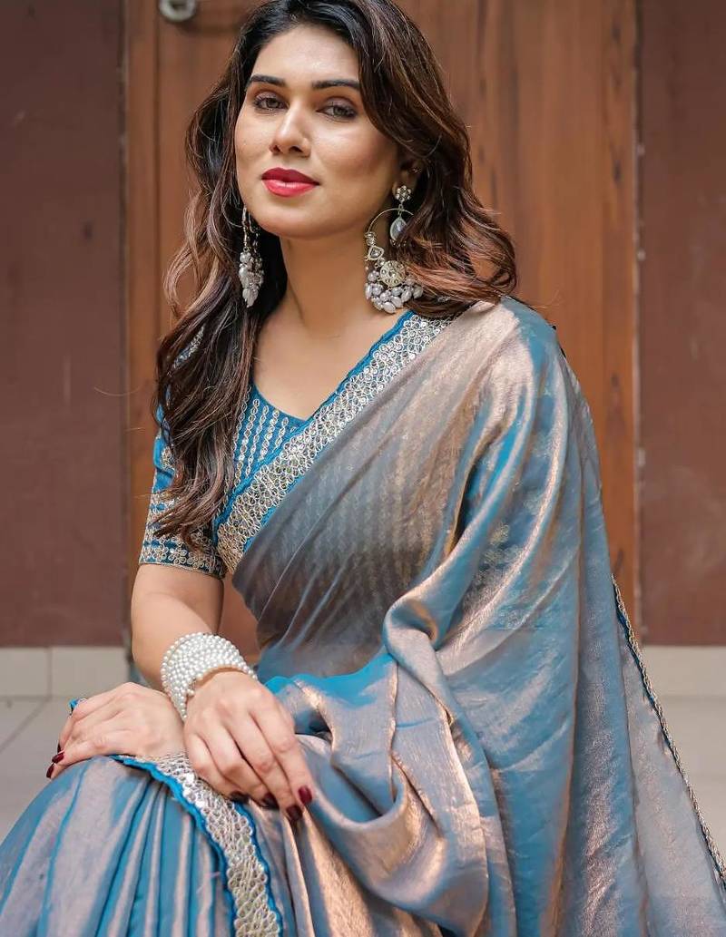 blue chiffon embroidered border saree with embroidered blouse