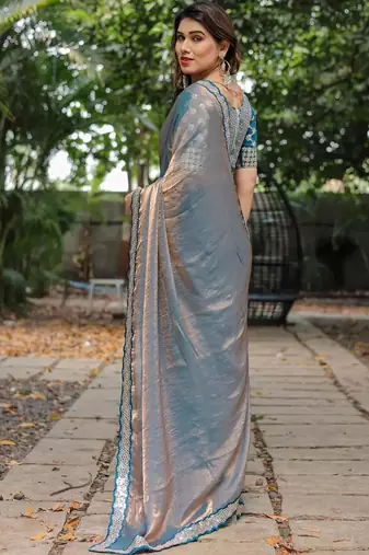 blue chiffon embroidered border saree with embroidered blouse