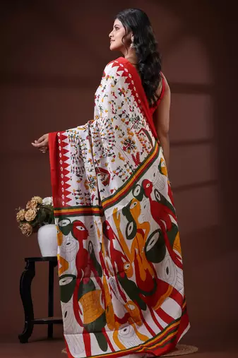 Off white  malmal cotton saree with multicolor tribal art handblock print & red border design