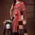 Red & black  malmal cotton saree with contrast border & geometric pallu
