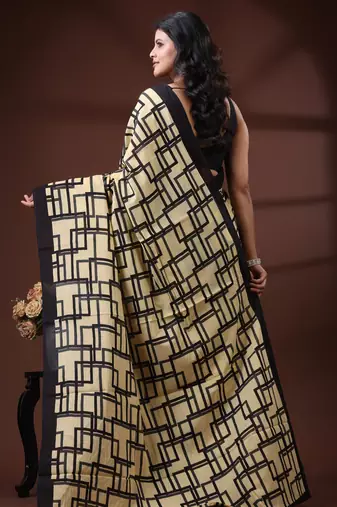Beige & black geometric printed  malmal cotton saree with contrast border