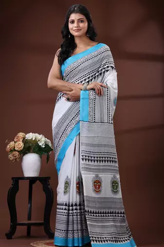 White & sky blue  malmal cotton saree with tribal face motif and geometric handblock print design