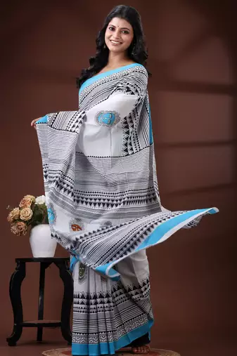 White & sky blue  malmal cotton saree with tribal face motif and geometric handblock print design