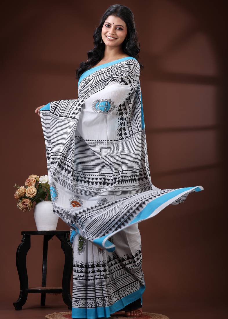 White & sky blue  malmal cotton saree with tribal face motif and geometric handblock print design