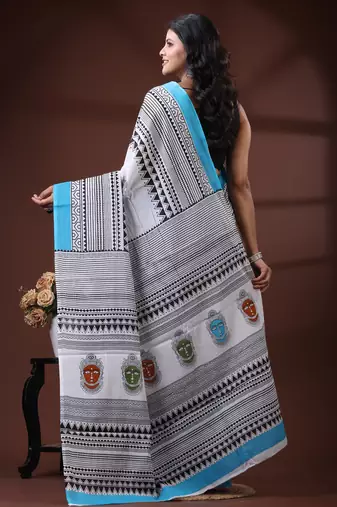 White & sky blue  malmal cotton saree with tribal face motif and geometric handblock print design