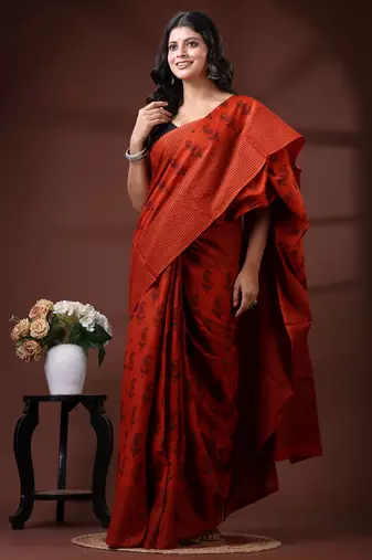 Rust orange & black paisley printed  malmal cotton saree with striped pallu