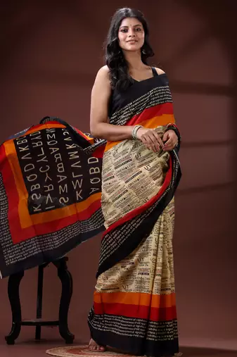 Beige  malmal cotton saree with newspaper & typography print in red and black