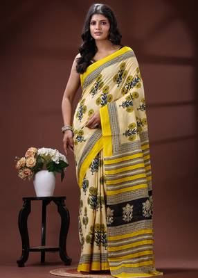 Beige  malmal cotton saree in yellow floral buti print with contrast border 1