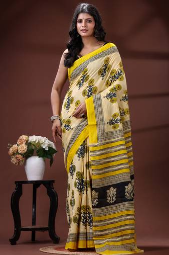 Beige  malmal cotton saree in yellow floral buti print with contrast border