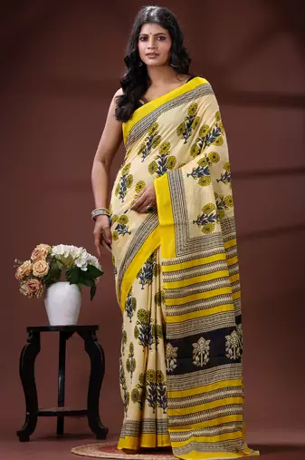 Beige  malmal cotton saree in yellow floral buti print with contrast border