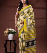 Beige  malmal cotton saree in yellow floral buti print with contrast border