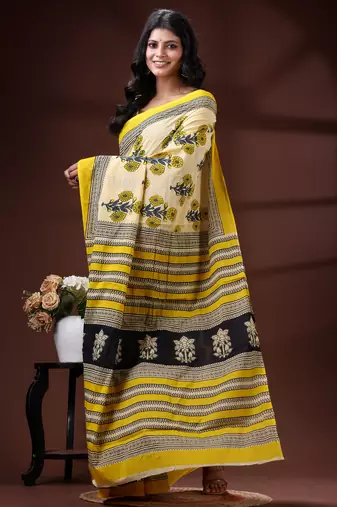 Beige  malmal cotton saree in yellow floral buti print with contrast border