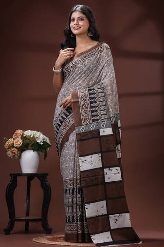 Coffee brown  malmal cotton saree in ethnic batik print with geometric block pallu