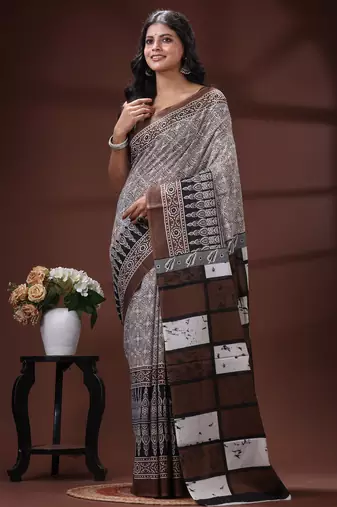 Coffee brown  malmal cotton saree in ethnic batik print with geometric block pallu