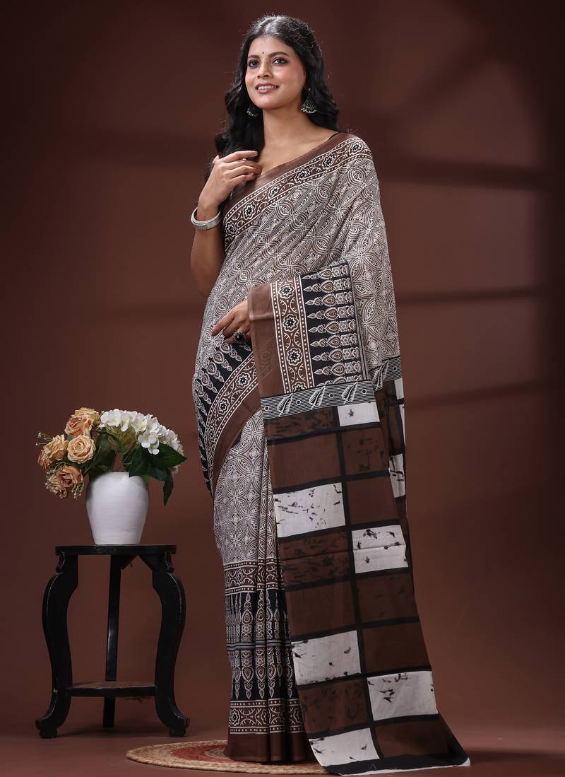 Coffee brown  malmal cotton saree in ethnic batik print with geometric block pallu