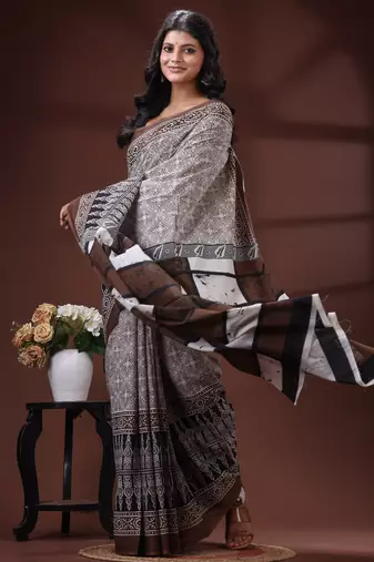 Coffee brown  malmal cotton saree in ethnic batik print with geometric block pallu