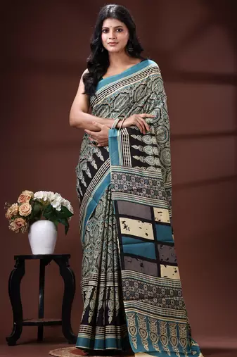 Teal blue  malmal cotton saree in ethnic mandala print with geometric block pallu