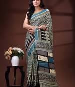 Teal blue  malmal cotton saree in ethnic mandala print with geometric block pallu