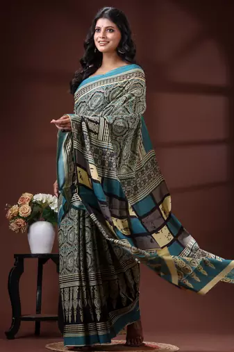 Teal blue  malmal cotton saree in ethnic mandala print with geometric block pallu