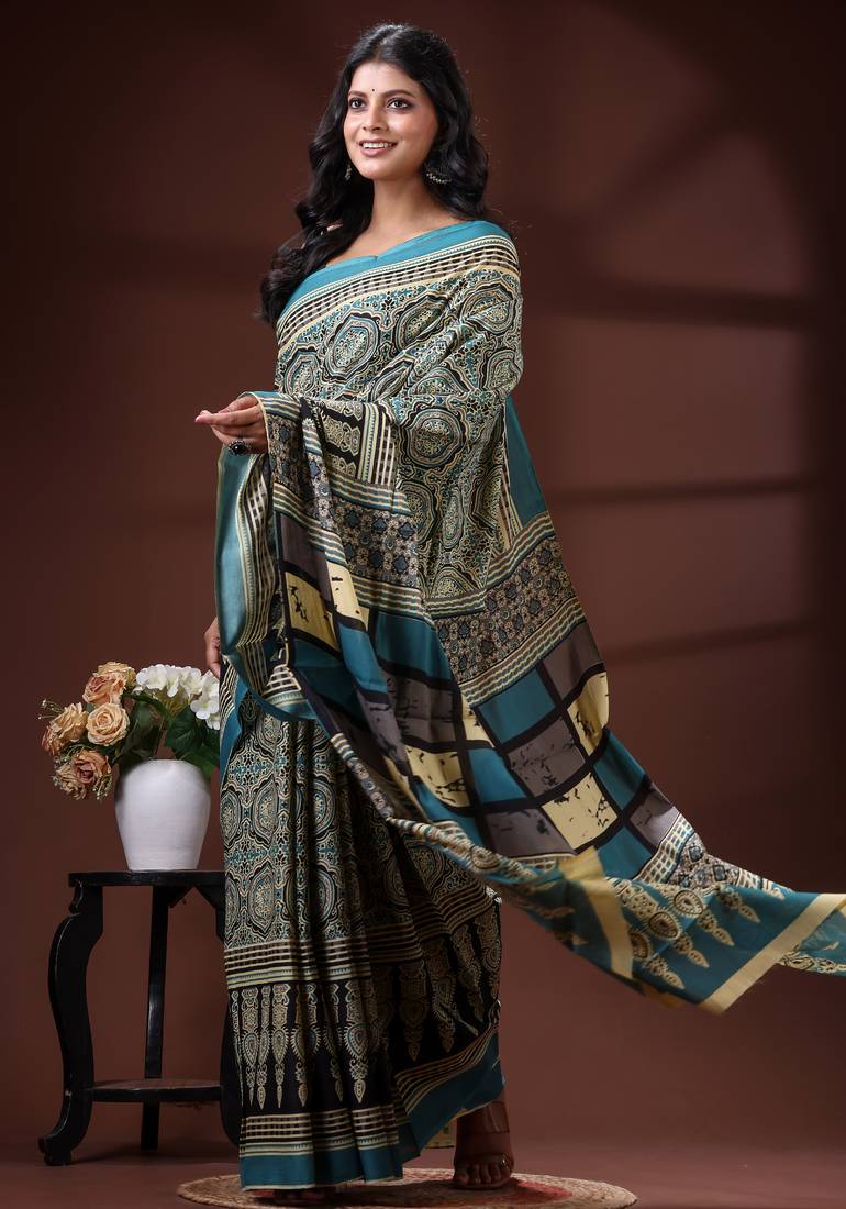 Teal blue  malmal cotton saree in ethnic mandala print with geometric block pallu