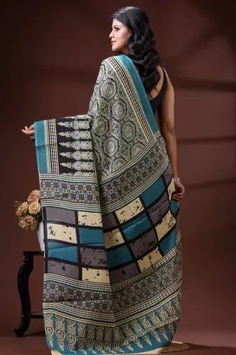 Teal blue  malmal cotton saree in ethnic mandala print with geometric block pallu