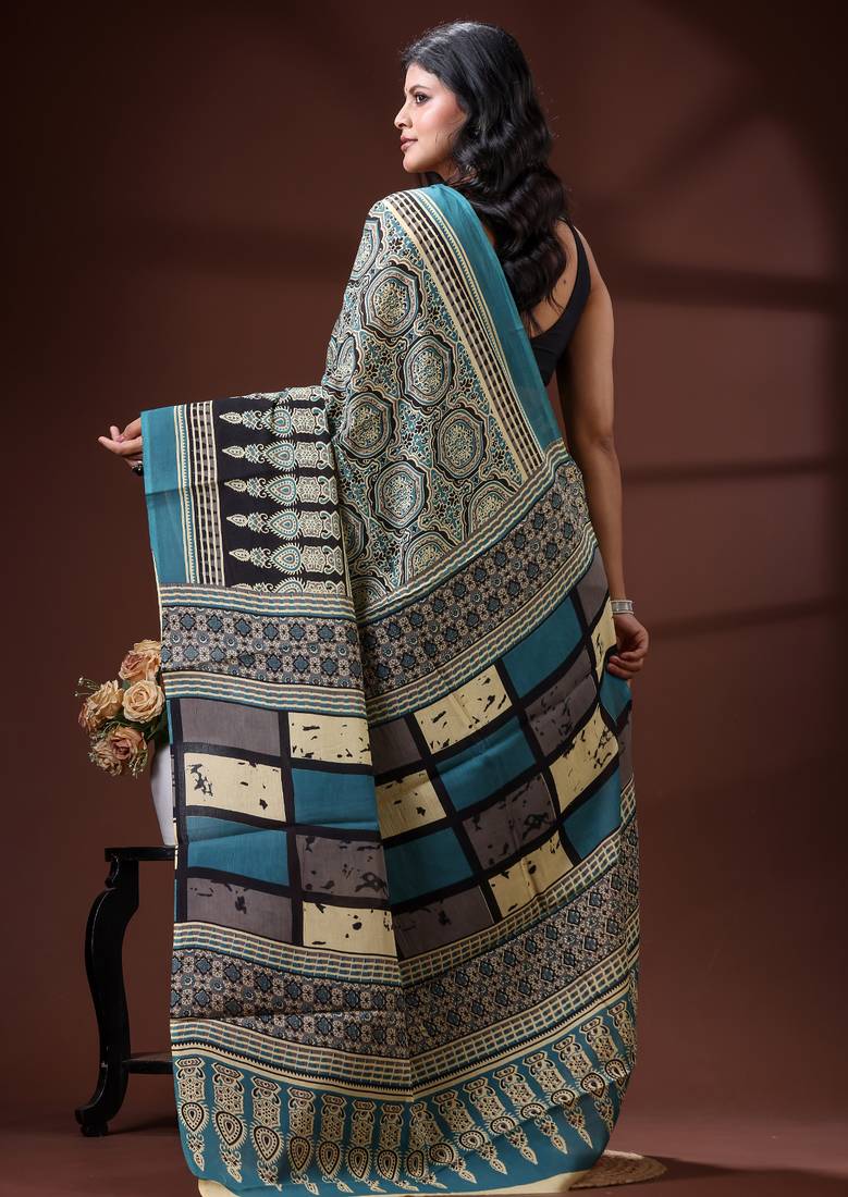 Teal blue  malmal cotton saree in ethnic mandala print with geometric block pallu