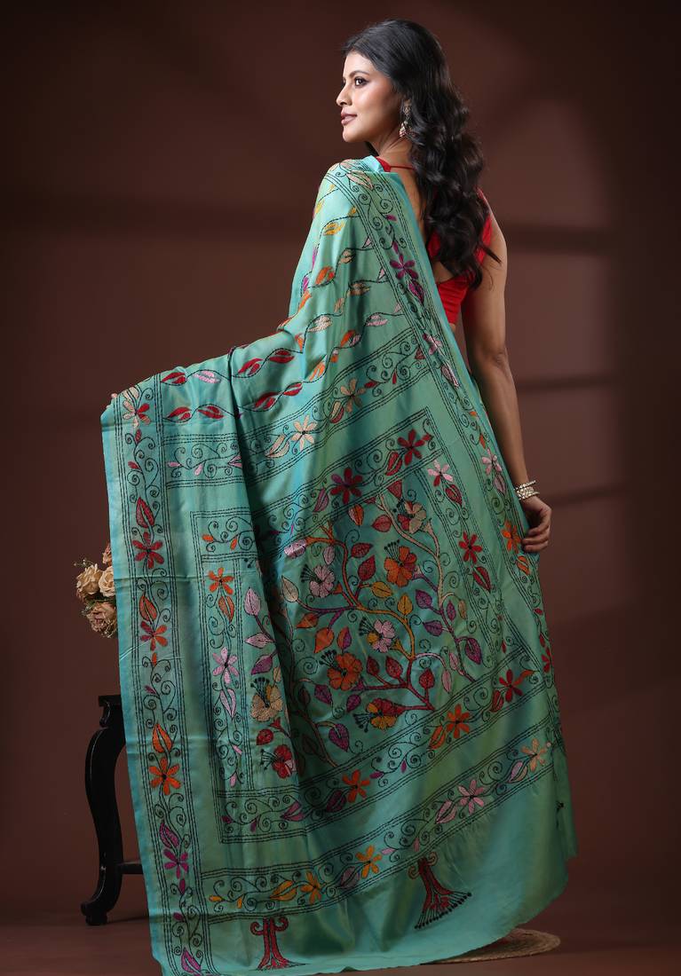 Seafoam green silk blend kantha saree with multicolored floral vine nakshi pallu