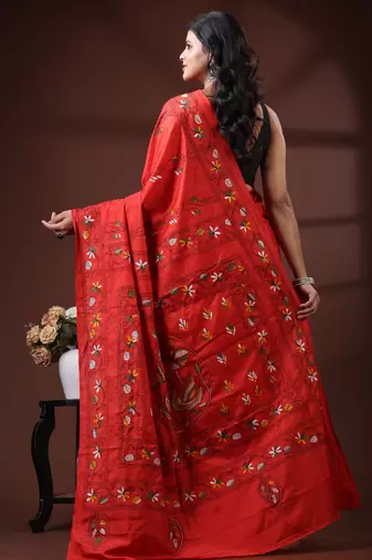 Vibrant red silk blend kantha saree with hand-embroidered peacock nakshi pallu