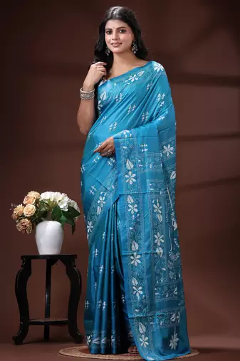 Turquoise blue silk blend kantha saree with white floral & folk art woven design