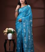 Turquoise blue silk blend kantha saree with white floral & folk art woven design