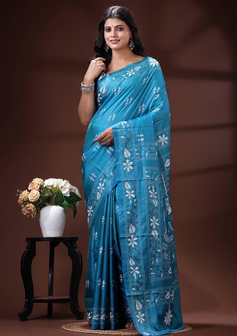 Turquoise blue silk blend kantha saree with white floral & folk art woven design