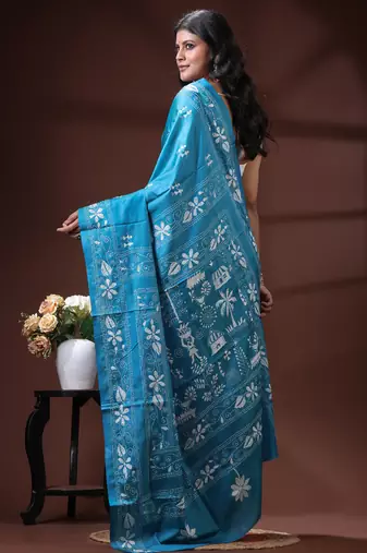Turquoise blue silk blend kantha saree with white floral & folk art woven design