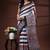 Earthy multicolor malmal cotton saree with block-print style borders and horizontal stripe body