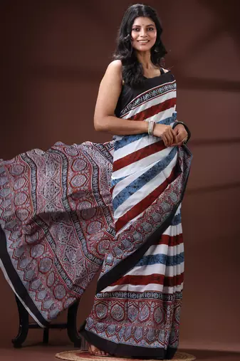 Earthy multicolor malmal cotton saree with block-print style borders and horizontal stripe body